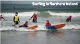  ??  ?? Surfing in Northern Ireland