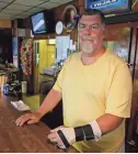  ?? MANDI WRIGHT/USA TODAY NETWORK ?? Jack Nadwornik, owner of Tujax Tavern in Delton, Mich., said police, including two reserve officers, broke his hand, kneed him and bloodied his knees during an arrest in 2014. Nadwornik sued and won a settlement. He said the reserve police force was out of control before it was disbanded.