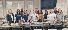  ?? Courtesy of HomeAid ?? A volunteer team from Howard Hughes Corporatio­n pitched in for 800-1,000 holiday meals to benefit three partner organizati­ons in the greater Houston area — Angel Reach, Compassion United, and Fort Bend Women’s Center.