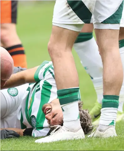  ?? ?? Jota is given treatment after hitting the turf during a game against Dundee United