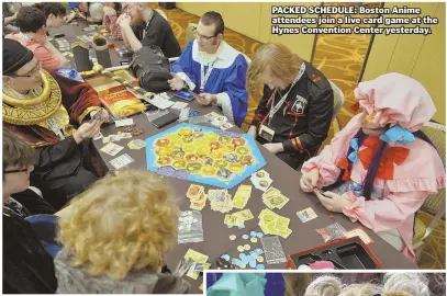  ??  ?? PACKED SCHEDULE: Boston Anime attendees join a live card game at the Hynes Convention Center yesterday.