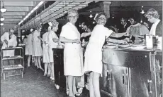  ??  ?? WORKING LIVES: From left, queueing up at Burtons Canteen, April 1994; Burton Beauty Queen contest 1950 at the Burton Walkden Works; Burton Miss Personalit­y, with the first winner Sandra Backhouse, front right.