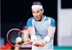  ?? Reuters ?? ↑
Rafael Nadal returns the ball to David Goffin (unseen) during their Madrid Open match on Thursday.