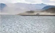  ?? Associated Press file ?? Wind kicks up dust in 2015 in an area that was once underwater at the Boulder Harbor boat ramp in the Lake Mead National Recreation Area near Boulder City, Nev.