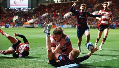  ?? ?? Bristol’s Toby Fricker touches down for the winning try despite Jordy Reid’s attempt to tackle him