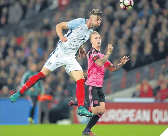  ??  ?? ■ Gary Cahill, seen here clearing from Scotland’s Leigh Griffiths on Friday, says England have progressed under Southgate.