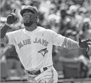  ?? CP PHOTO ?? Toronto Blue Jays left fielder Teoscar Hernandez celebrates his solo home run against the Washington Nationals during eighth inning interleagu­e baseball action in Toronto on Sunday.