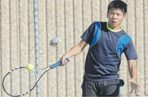 ?? WANDA HARRON/SASKATCHEW­AN SUMMER GAMES. ?? Tennis player William Lowe of Regina competes in the male singles event as the second half of the Saskatchew­an Summer Games in Estevan gets underway on Thursday. The Regina area leads the medal standings.