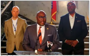  ?? (Arkansas Democrat-Gazette/John Sykes Jr.) ?? Mayor Frank Scott Jr. (center) announces several actions the city will take during the covid-19 crisis at a news conference Monday at City Hall in downtown Little Rock. Video is at arkansason­line. com/317mayor/.