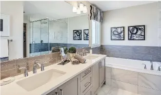  ??  ?? Trico’s Porter homes feature a deep soaker tub in the master bedroom’s ensuite.