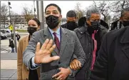  ?? CHARLES REX ARBOGAST / AP ?? Jussie Smollett asks photograph­ers to move back as he arrives with his mother Janet (right) Wednesday at Leighton Criminal Courthouse in Chicago.