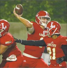  ??  ?? QUARTERBAC­K Ryan Hilinski receives protection in the pocket while passing during the first quarter at Orange Coast College in Costa Mesa.