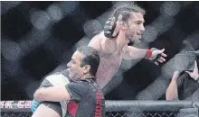  ?? CANADIAN PRESS FILE PHOTO ?? Elias (The Spartan) Theodorou of Mississaug­a, pictured celebratin­g a unanimous decision over Cezar Ferreira in 2017, takes on Eryk (Ya Boi) Anders on the undercard of UFC 231 at Scotiabank Arena on Saturday.