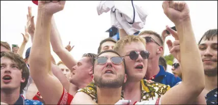  ?? AP PHOTO ?? England supporters celebrate their team’s 6-1 victory watching the group G soccer match between England and Panama at the 2018 World Cup in Moscow, Russia.