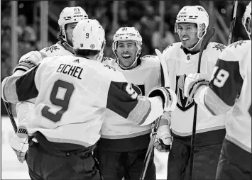  ?? KARL B. DEBLAKER / ASSOCIATED PRESS ?? The Vegas Golden Knights’ Jonathan Marchessau­lt, center, and Brayden Mcnabb, second from right, recently achieved profession­al milestones. Marchessau­lt notched his 600th career NHL game while Mcnabb played in his 700th.