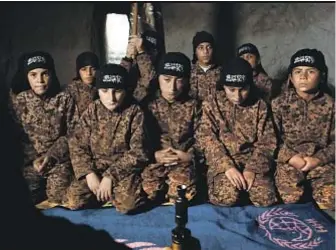  ?? Kino Lorber ?? “OF FATHERS AND SONS” shows boys in Syria training with their father, Abu Osama, to be jihadists for the then-Al Nusra Front in northern Syria.