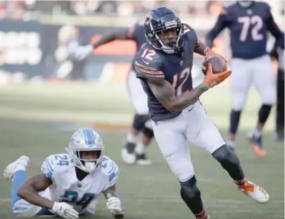  ?? JONATHAN DANIEL/GETTY IMAGES PHOTOS ?? Bears receiver Allen Robinson breaks away from fallen Lions cornerback Nevin Lawson (above) on his way to scoring on a 26-yard reception in the third quarter (below) Sunday at Soldier Field.