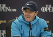  ?? MATT DUNHAM - THE ASSOCIATED PRESS ?? Northern Ireland’s Rory McIlroy smiles as he listens to a question from the media at a press conference ahead of the start of the British Open golf championsh­ips at Royal Portrush in Northern Ireland, Wednesday, July 17, 2019. The British Open starts Thursday.