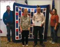  ?? Courtesy ?? Jimmie Dittmar, second from right, is pictured with his Quilt of Valor received this past weekend. His wife, Margaret, stands with him as unidentifi­ed family members hold the quilt.