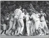  ?? AP/NAM Y. HUH ?? Dodgers players celebrate after Thursday after winning Game 5 of the National League Championsh­ip Series against the Cubs in Chicago.
