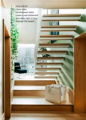  ??  ?? HALLWAY Open-plan cantilever­ed stairs make a real statement and allow light to flow through the space