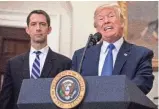  ??  ?? POOL PHOTO BY ZACH GIBSON President Trump endorses the Reforming American Immigratio­n for Strong Employment (RAISE) Act with Sen. Tom Cotton, R-Ark.