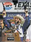  ?? TONY GUTIERREZ THE ASSOCIATED PRESS ?? Jimmie Johnson fires commemorat­ive pistols in Victory Lane after winning the NASCAR Cup Series race Sunday at Texas Motor Speedway in Fort Worth, Texas.