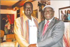  ??  ?? BIRDS OF A FEATHER . . . Raila Odinga and Morgan Tsvangirai