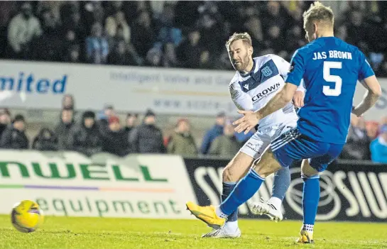  ?? ?? ON THEIR WAY: Niall Mcginn puts Dundee 2-0 up against Peterhead – but it wasn’t all plain sailing against a spirited Blue Toon side.