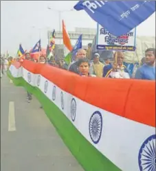  ?? SAKIB ALI/HT PHOTOS ?? (From left) Members of Samajwadi Bahujan Manch taking part in a 'mati sankalp march'; They also took out a ‘tiranga yatra’ in which they carried a 150-metre tricolour.