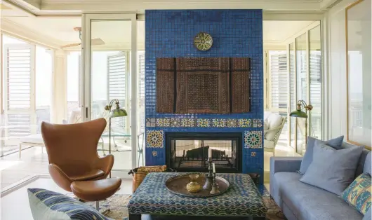  ?? WILLIAM ABRANOWICZ ?? Interior designer Mona Hajj used mudejar tiles to create a distinctiv­e fireplace surround for a client.