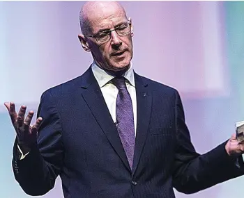  ??  ?? Defeat: John Swinney attends an education conference in Glasgow yesterday