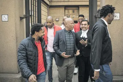  ?? Picture: Jacques Nelles ?? TEAM SPIRIT. Julius Malema leaves the Equality Court sitting in the High Court in Pretoria during a lunch break yesterday in the case against the EFF by the SA National Editors’ Forum.