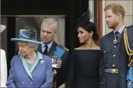  ?? MATT DUNHAM — THE ASSOCIATED PRESS FILE ?? Britain’s Queen Elizabeth II, Prince Andrew, Meghan the Duchess of Sussex and Prince Harry stand on a balcony in London.