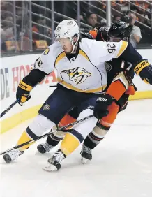  ?? SEAN M. HAFFEY/GETTY IMAGES ?? Nashville Predators centre Ryan Johansen, front, seen protecting the puck from Anaheim Ducks centre Ryan Kesler in Game 2 on Sunday in Anaheim, Calif., is “a skilled player and I play the game hard. Obviously he doesn’t like that,” Kesler says.