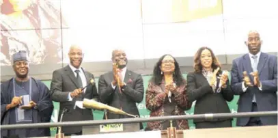  ??  ?? L – R: Ibrahim Hassan, non-executive director, GTBank Plc; Segun Agbaje, group chief executive officer, Guaranty Trust Holding Company (GTCO) Plc; Temi Popoola, CEO, Nigerian Exchange (NGX) Limited; Osaretin Demuren, former chairman, GTBank Plc; Miriam Olusanya, managing director, GTBank Plc, and Seyi Osunkeye, non- executive director, NGX Limited, during a closing gong ceremony to commemorat­e the listing of GTCO on NGX at the NSO, Lagos recently.