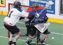  ?? CLIFFORD SKARSTEDT EXAMINER ?? Peterborou­gh Century 21 Lakers goalie Evan Kirk stops Oakville Rock’s Brett Hickey at the Memorial Centre on Thursday night in Game 5.