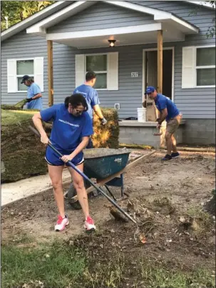  ?? Submitted photo ?? HELPING HANDS: Volunteers from CHI St. Vincent Hot Springs lay sod at a new Habitat for Humanity home on Saturday. Photo is courtesy of Courtney Post.