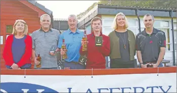  ?? Photos: Kevin McGlynn ?? Runners-up were Team Murphy – James Muir, Phillip Murphy, Steven Murphy and Neil Carmichael – pictured with Marianne MacEachan and her daughter Ann.