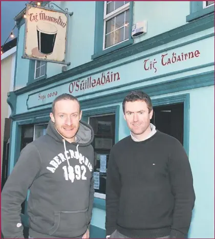  ?? Photo by Marian O’Flaherty ?? Recently retired Kerry footballer Tommy Griffin (left) and Padraic Corcoran outside Muiris Dan’s on John Street, Dingle.