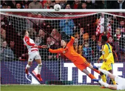  ?? (Reuters) ?? DONCASTER ROVERS midfielder Alfie May (left) misses a chance to score past Crystal Palace goalkeeper Wayne Hennessey during Palace’s 2-0 away victory over Doncaster last night in FA Cup fifth-round action at Keepmoat Stadium.