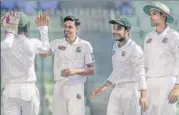  ?? AFP ?? Bangladesh’s Taijul Islam (2nd left) celebrates with teammates.