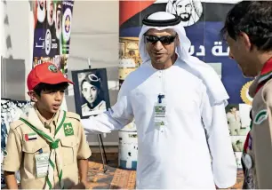  ?? — Supplied photos ?? Dr Abdulla Al Karam alongside a scout during the outing organised by the KHDA.