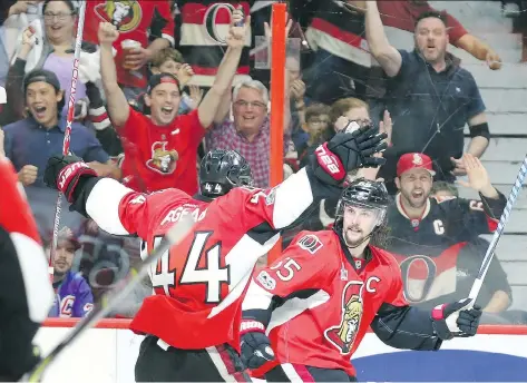  ?? JEAN LEVAC ?? Ottawa Senators defenceman Erik Karlsson, right, celebrates his game-winning goal against the New York Rangers with centre Jean-Gabriel Pageau during the third period of Game 1 of their Eastern Conference semifinal series at the Canadian Tire Centre in...