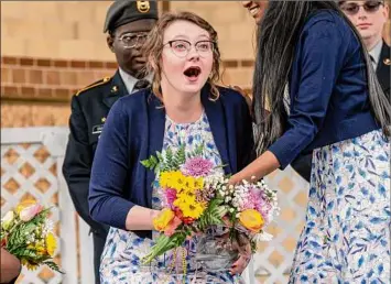  ?? Photos by James Franco / Special to the Times Union ?? Sam Mills reacts to being crowned Tulip Queen during the 74th Tulip Festival in Washington Park in Albany on Saturday.