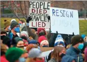  ?? CHRISTIAN GOODEN/ ST. LOUIS POST-DISPATCH VIA AP ?? About 300 demonstrat­ors gather after painting a sign in the middle of Broadway Saturday outside the historic Old Courthouse in downtown St. Louis. Speakers called for Sen. Josh Hawley, R-Mo., to resign following a seizure and occupation of the U.S. Capitol in Washington.