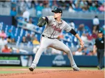  ?? MICHAEL LAUGHLIN/AP ?? Braves pitcher Max Fried throws to a Marlins batter during the first inning Friday in Miami.