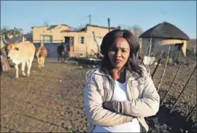  ??  ?? Razed: Elizabeth Hadebe (left) stands near the rubble of what used to be her home in Kliprand near Newcastle in KwaZulu-Natal. Thembekile Ngwenya (above), whose family has lived in Kliprand for more than 40 years, lives with the constant worry that...