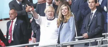  ?? Associated Press ?? ↑
Boris Johnson at the stands prior to the Euro 2020 football championsh­ip at Wembley stadium in London on Wednesday.