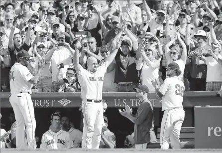  ?? By Bob Dechiara, US Presswire ?? Curtain call: Kevin Youkilis waves to the Fenway Park crowd after being taken out in the seventh inning, ending his Red Sox career after 8½ seasons.